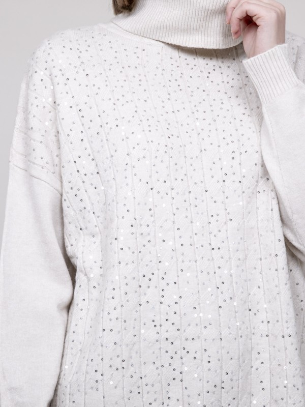 Pull col roulé à sequins...